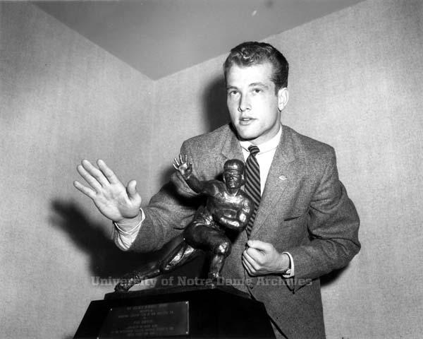 Notre Dame's Paul Hornung posing with his Heisman Trophy in 1956.